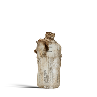 Dulcie Marine Facial Cleanser 100mL bottle in shown in a decomposed state to illustrate material breakdown