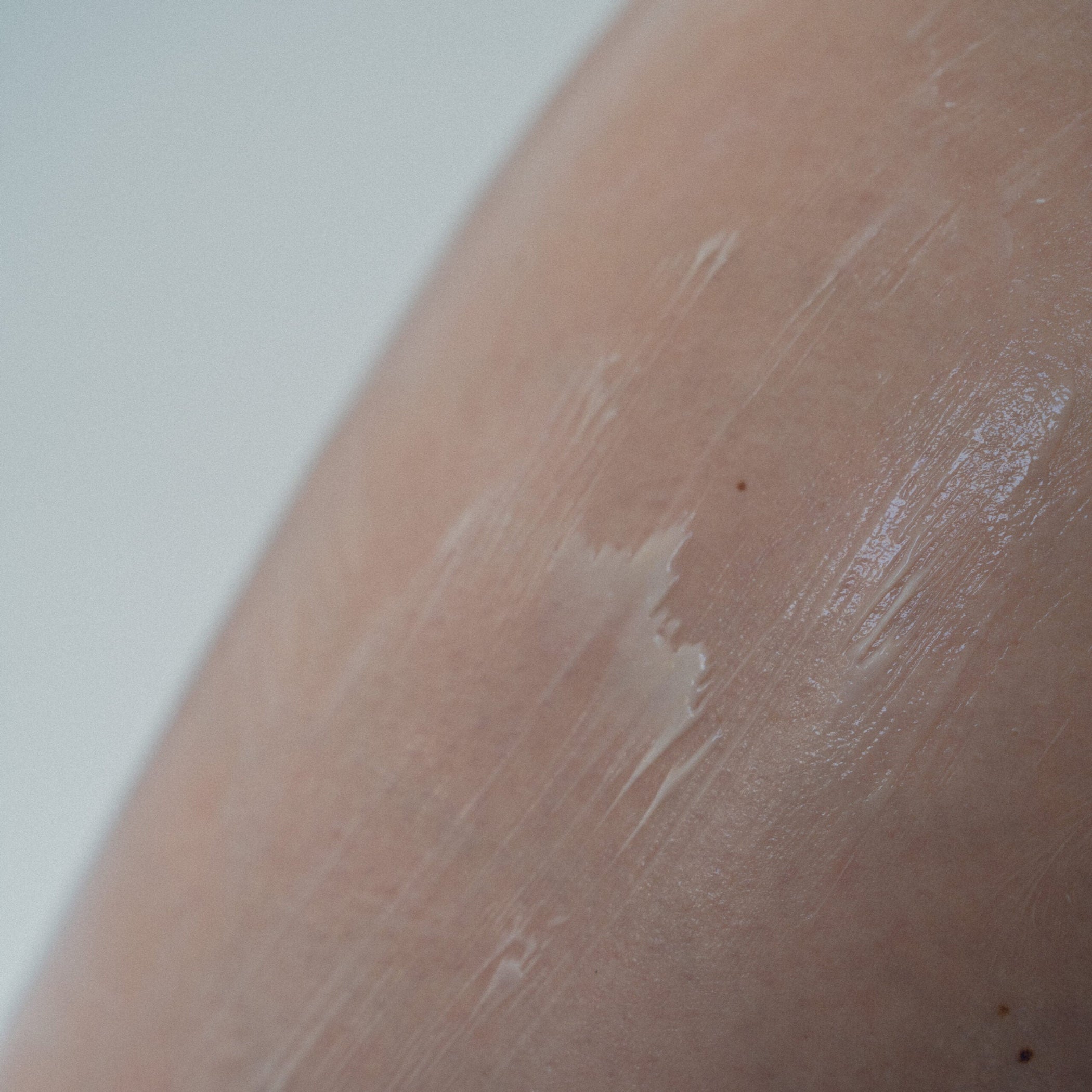 Close-up of lotion smeared on skin