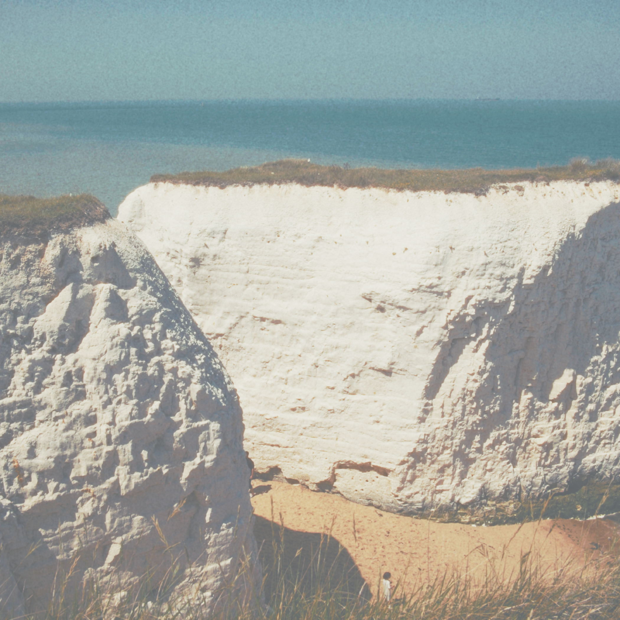 White cliffs with ocean in the background and blue sky