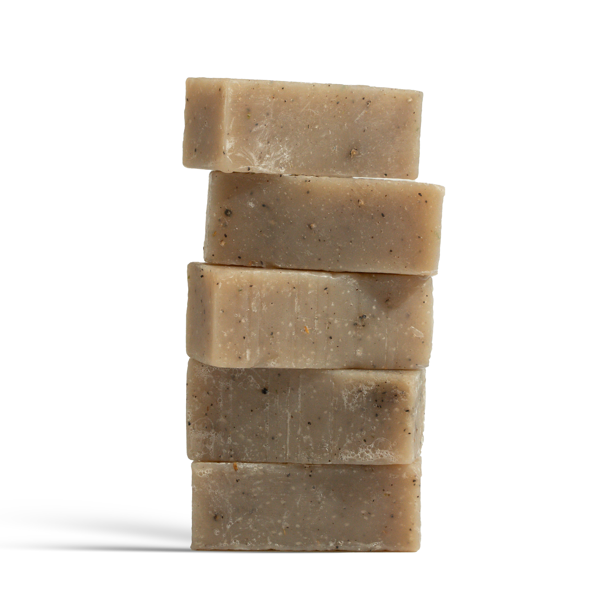 Dulcie Ozone Exfoliating Coffee + Seaweed Block, soap cut up and stacked vertically with visible specks of coffee grounds and seaweed 