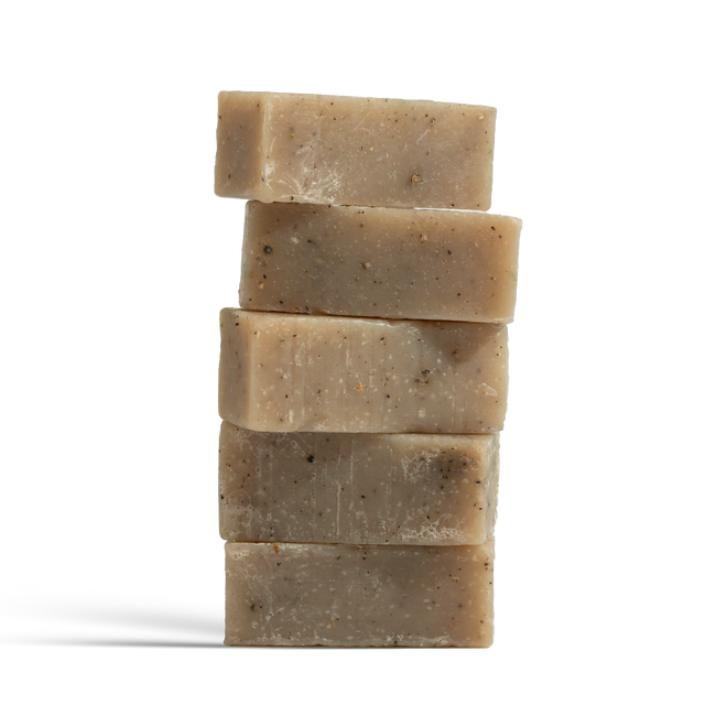 Dulcie Ozone Exfoliating Coffee + Seaweed Block, soap cut up and stacked vertically with visible specks of coffee grounds and seaweed 