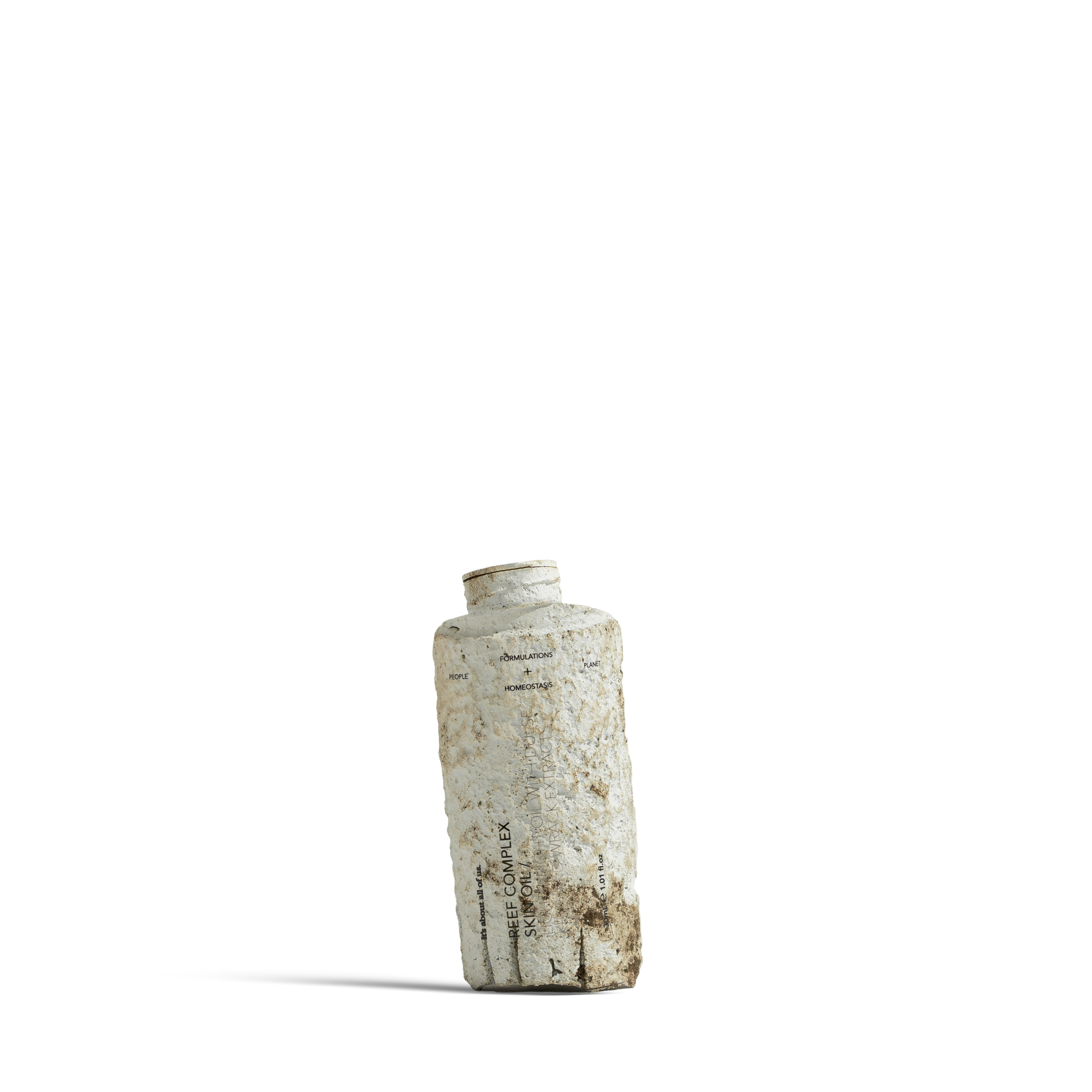 Dulcie Reef Complex Skin Oil 30mL bottle shown in a decomposed state to illustrate material breakdown